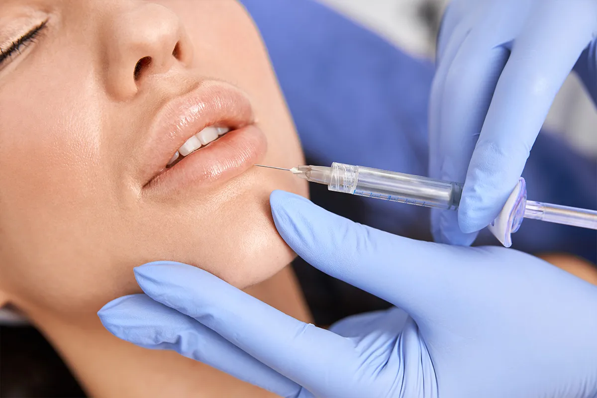 Close-up of a cosmetic lip injection procedure performed by a professional, showcasing safe and precise lip fillers abu dhabi treatment. Close-up of a cosmetic lip injection procedure performed by a professional, showcasing safe and precise lip fillers abu dhabi treatment.